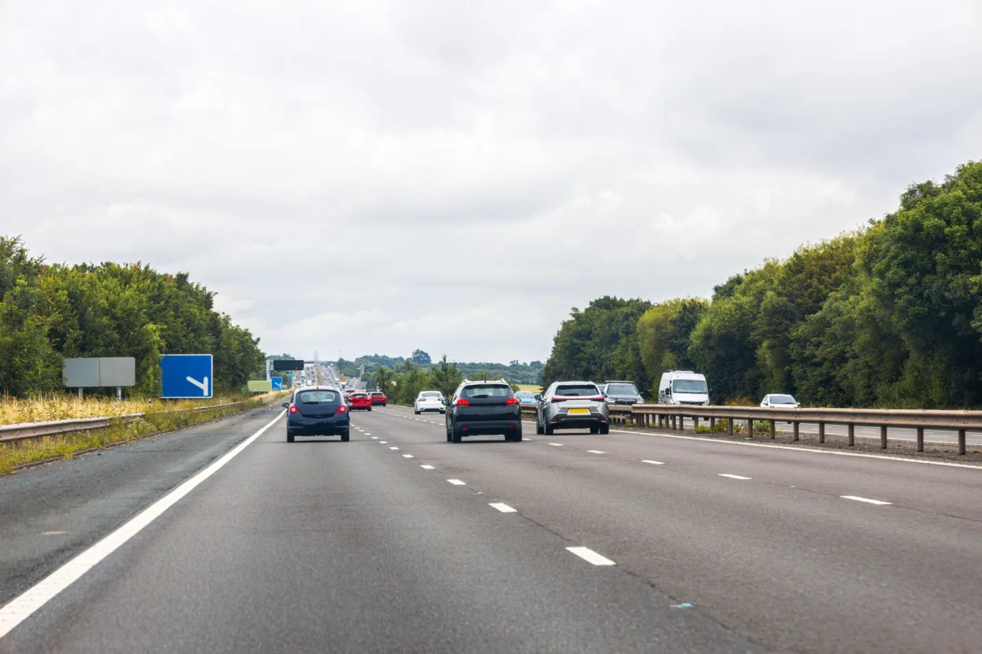 Private car travelling on a UK road from Luton Airport towards London and wider UK destinations